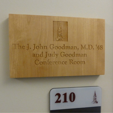 J. John Goodman wooden sign