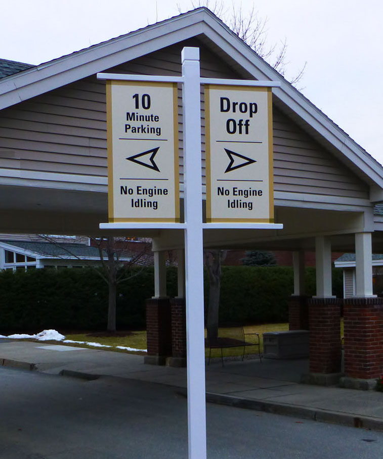 Kendal Directional Sign Two signs under a canopy indicate directions for 10-minute parking and drop-off, both stating "No Engine Idling.