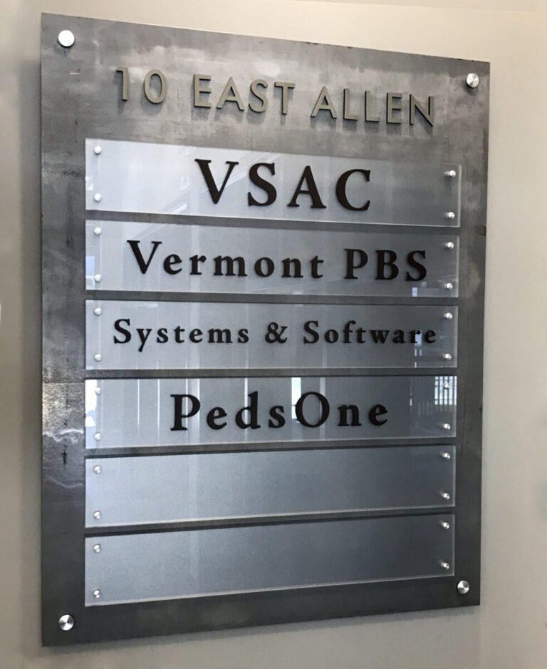 VSAC Directory Building directory sign listing VSAC, Vermont PBS, Systems & Software, and PedsOne at 10 East Allen.