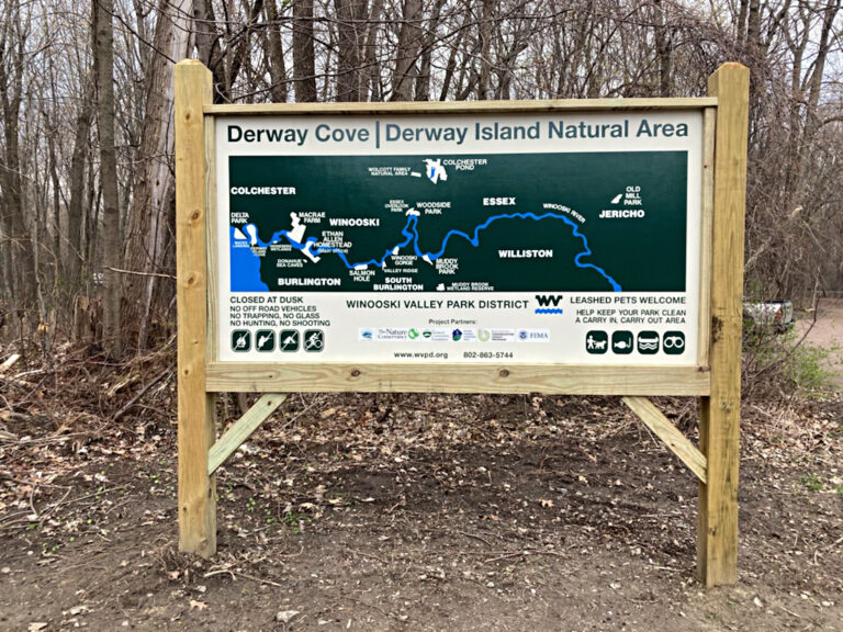 Derway Cove Island Wayfinding Wooden sign at Derway Cove showing a map of the Winooski Valley Park District and area rules.