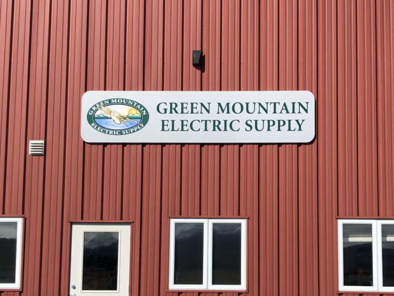 Green Mountain Electric Supply A red corrugated metal building with a sign reading "Green Mountain Electric Supply" above two windows and a door.