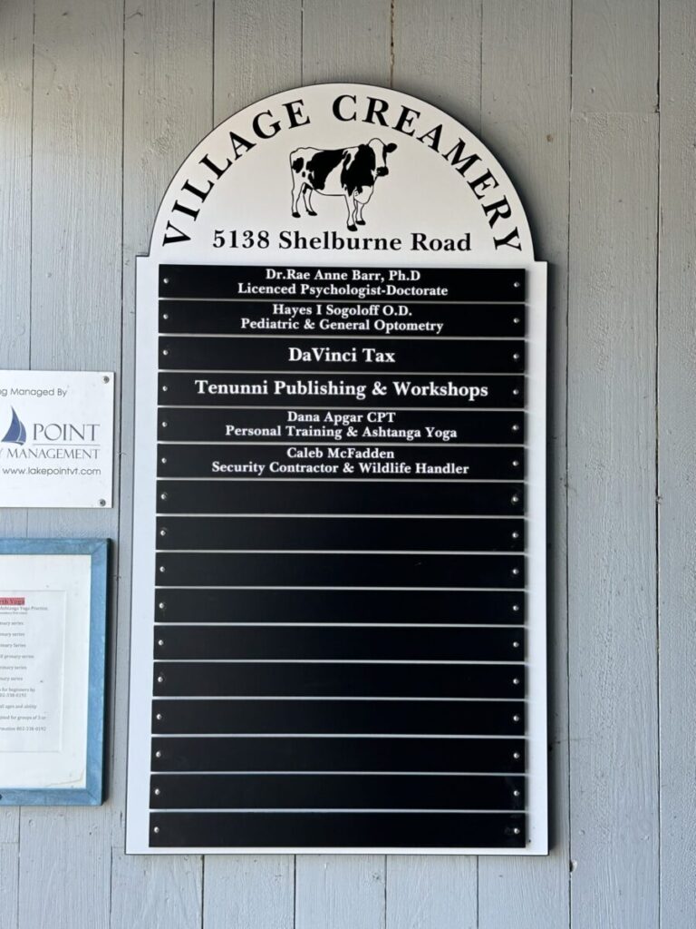 Village Creamery Directory A directory sign for Village Creamery at 5138 Shelburne Road lists businesses including medical, tax, and security services.
