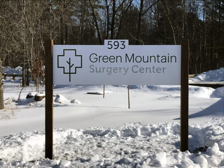 Aluminum Composite Sign A sign reading “Green Mountain Surgery Center 593” stands in a snowy outdoor area with trees in the background.