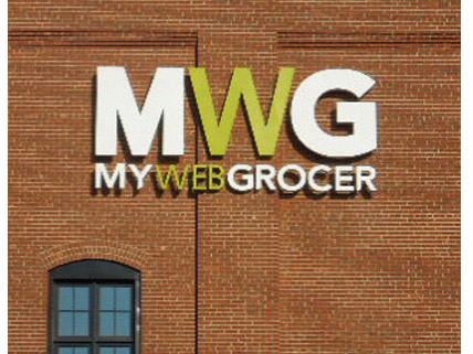 MWG My Web Grocer A brick wall displays the large sign "MWG MYWEBGROCER" above a small window.