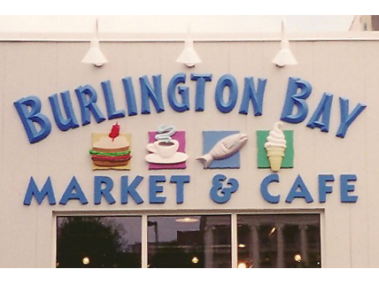 Burlington Bay Sign for Burlington Bay Market & Cafe with images of a sandwich, coffee, fish, and ice cream cone.